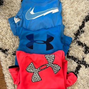 Nike and Under Armor hooded sweatshirts.